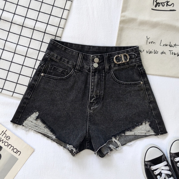 Sieviešu džinsi ar saplēstu rakstu un kabatām divās krāsās