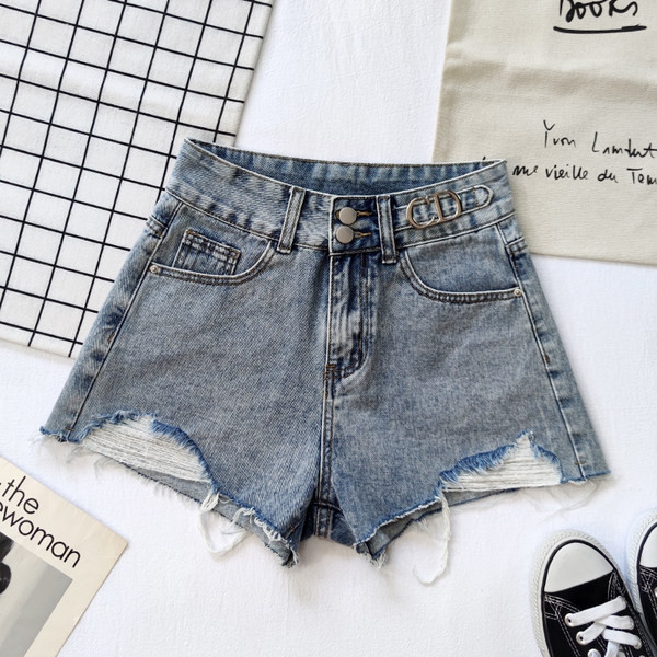 Sieviešu džinsi ar saplēstu rakstu un kabatām divās krāsās