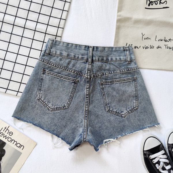 Sieviešu džinsi ar saplēstu rakstu un kabatām divās krāsās