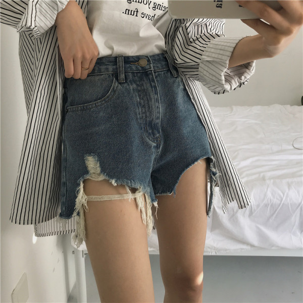 Pantaloni din denim cu elemente rupte - model asimetric