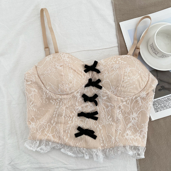 Moderni ženski poprsje s tankim naramenicama i vrpcama