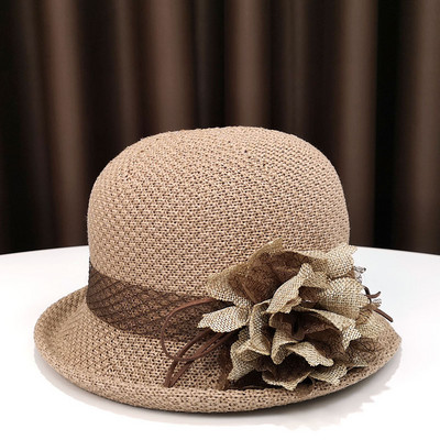 Pălărie modernă pentru femei cu o panglică și o borușă mică