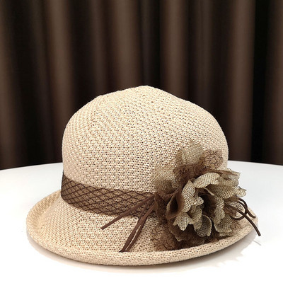 Pălărie modernă pentru femei cu o panglică și o borușă mică