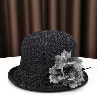 Pălărie modernă pentru femei cu o panglică și o borușă mică