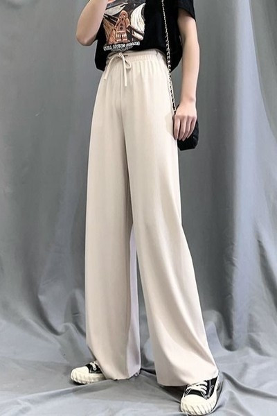 Moteriškų vasarinių kelnių platus modelis su kaklaraiščiais