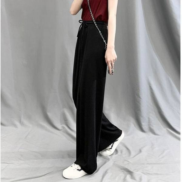 Moteriškų vasarinių kelnių platus modelis su kaklaraiščiais