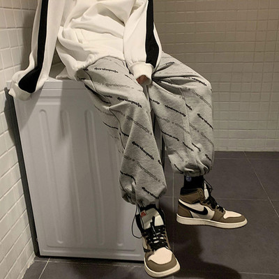 Ženske moderne hlače s natpisom i vezicama