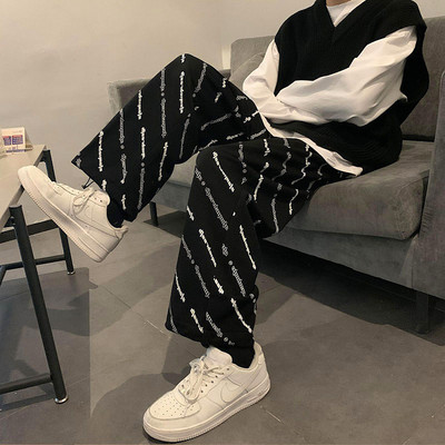 Ženske moderne hlače s natpisom i vezicama