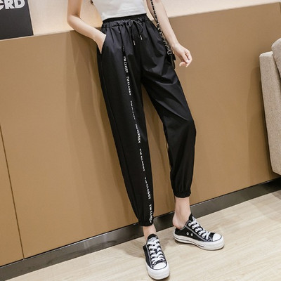Pantaloni casual de dama cu cravate si talie elastica in alb si negru