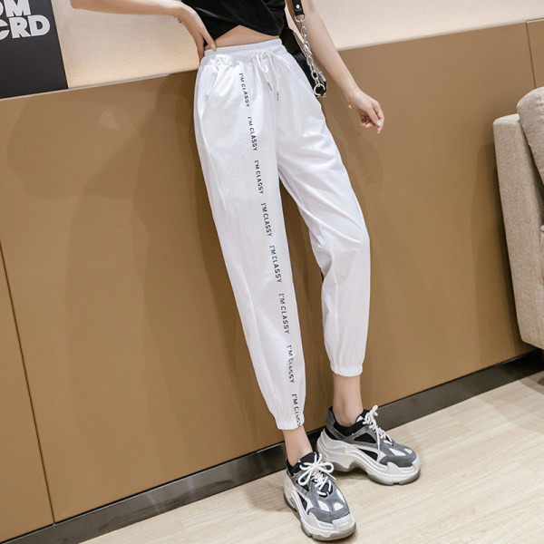 Pantaloni casual de dama cu cravate si talie elastica in alb si negru