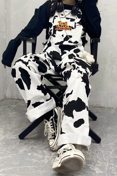 Γυναικείες ολόσωμες φόρμες με τσέπες σε λευκό χρώμα - φαρδύ μοντέλο