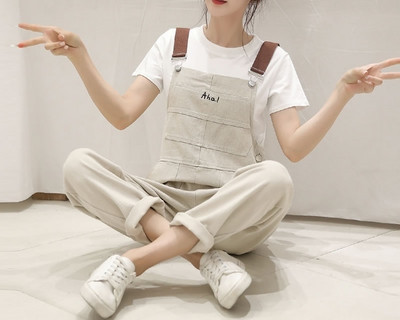 Salopeta de dama din denim cu bretele in negru si bej