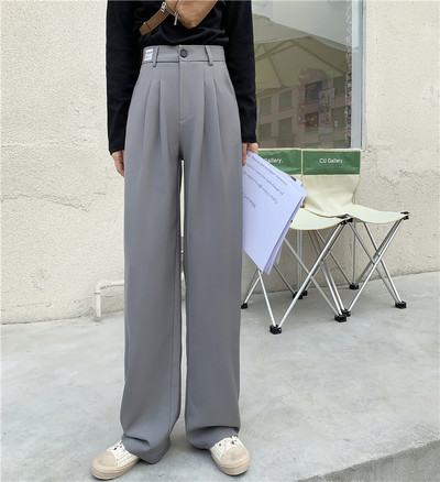 Model larg de pantaloni de dama cu talie inalta si buzunare