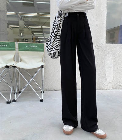 Model larg de pantaloni de dama cu talie inalta si buzunare