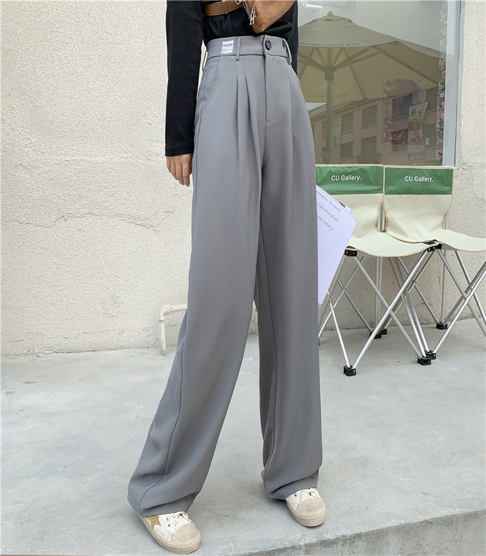 Model larg de pantaloni de dama cu talie inalta si buzunare