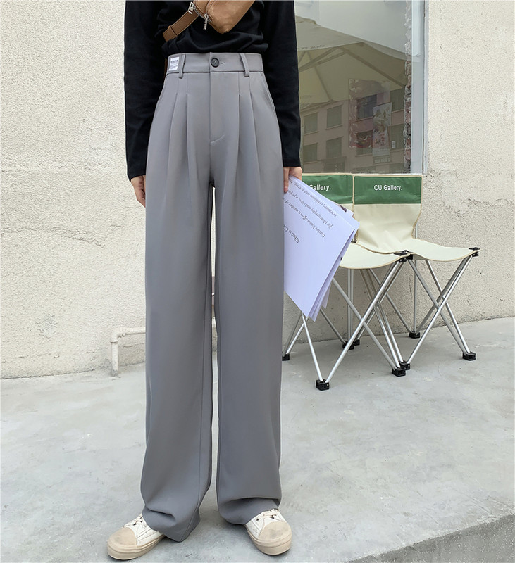 Model larg de pantaloni de dama cu talie inalta si buzunare