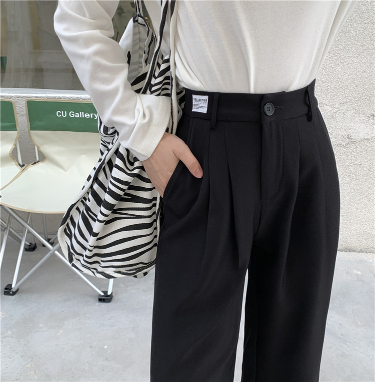 Model larg de pantaloni de dama cu talie inalta si buzunare