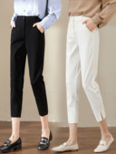 Pantaloni de damă în alb și negru cu fante