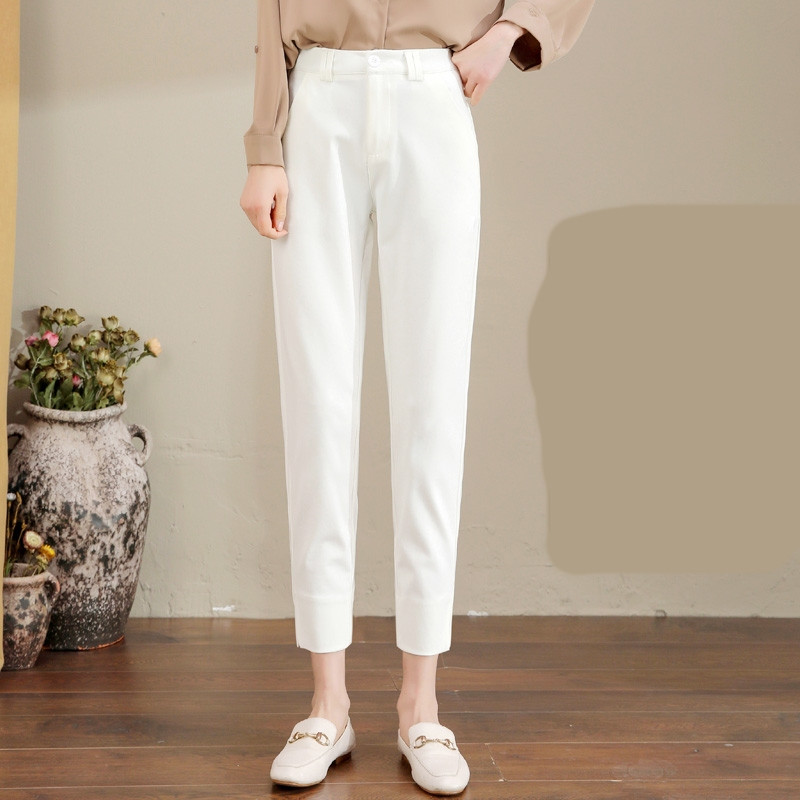 Pantaloni de damă în alb și negru cu fante