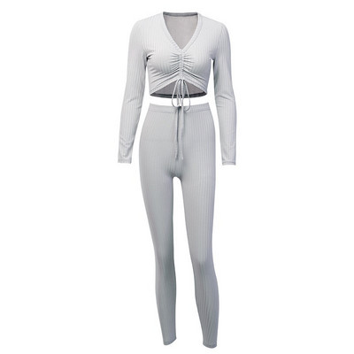 Moderan ženski komplet dugih tajica i kratke bluze na vezice