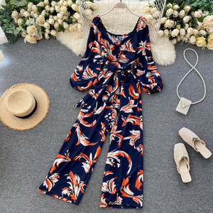 Salopeta de dama colorata cu centura si decolteu rotund