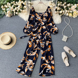 Salopeta de dama colorata cu centura si decolteu rotund