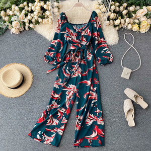 Salopeta de dama colorata cu centura si decolteu rotund