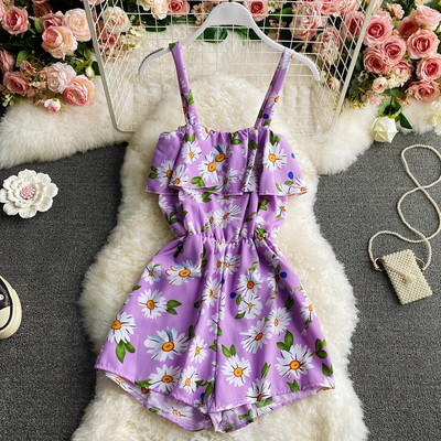 Women`s short jumpsuit with floral pattern and straps