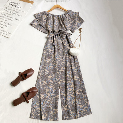 Γυναικεία μοντέρνα ολόσωμη φόρμα με λουλουδάτο μοτίβο και ζώνη στη μέση