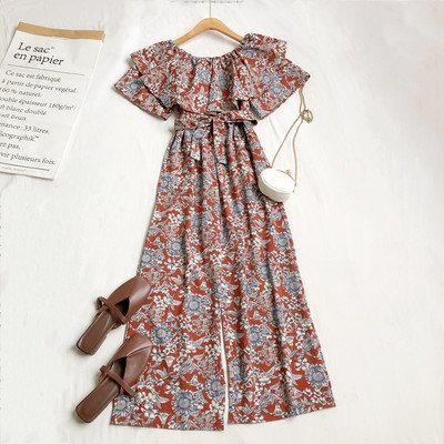 Γυναικεία μοντέρνα ολόσωμη φόρμα με λουλουδάτο μοτίβο και ζώνη στη μέση