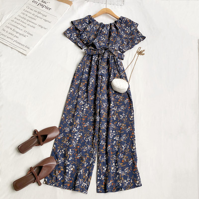 Γυναικεία μοντέρνα ολόσωμη φόρμα με λουλουδάτο μοτίβο και ζώνη στη μέση