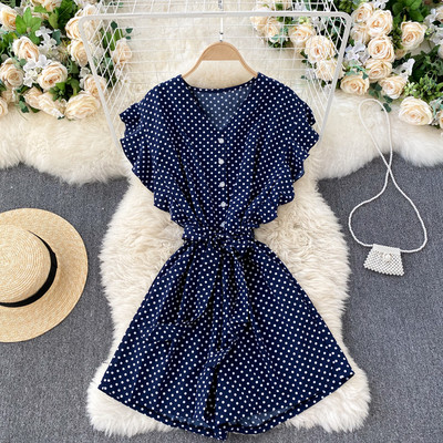 Salopetă de damă cu buline cu curea și decolteu spitz