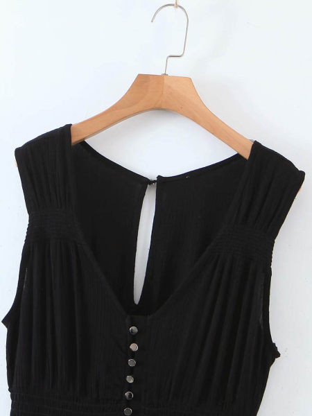 Salopetă lungă cu picioare largi și nasturi