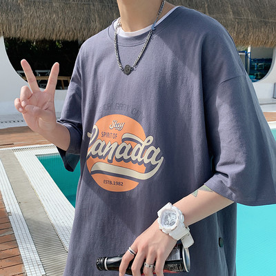 Proljetno-ljetna majica s gumbima i aplikacijama u boji