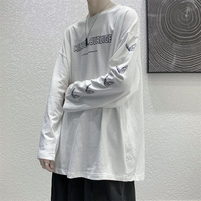 Bluză model larg cu mâneci lungi și aplicații