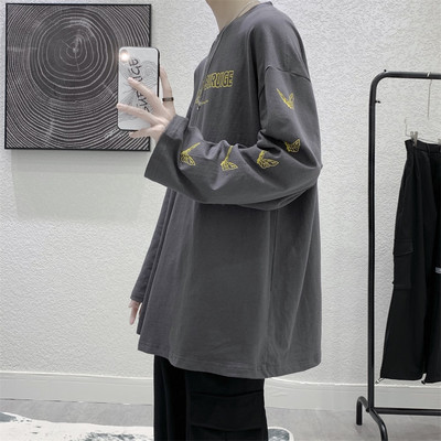 Bluză model larg cu mâneci lungi și aplicații