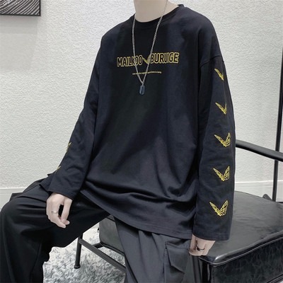 Bluză model larg cu mâneci lungi și aplicații