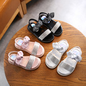 Sandale pentru copii cu talpa plate si particule lucioase si panglica