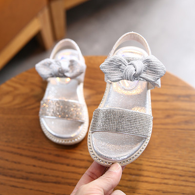 Sandale pentru copii cu talpa plate si particule lucioase si panglica