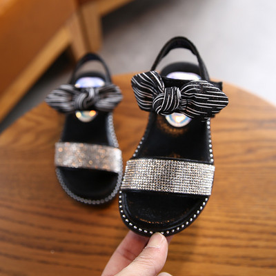 Sandale pentru copii cu talpa plate si particule lucioase si panglica