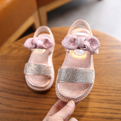 Sandale pentru copii cu talpa plate si particule lucioase si panglica