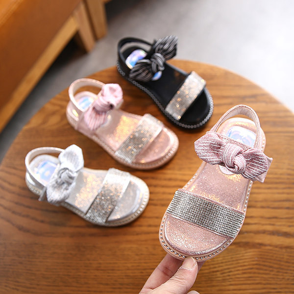 Sandale pentru copii cu talpa plate si particule lucioase si panglica