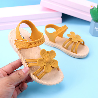 New model of children`s sandals with 3D flower element for girls