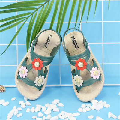 Casual children`s sandals with flowers for girls