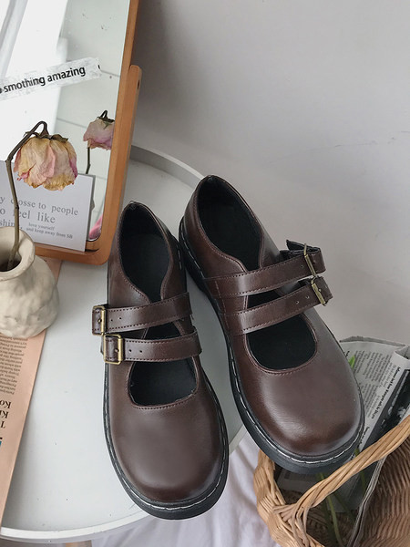 Sieviešu ādas apavi ar sprādzi brūnā un melnā krāsā