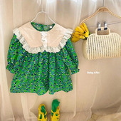 Jauna modeļa pavasara kleita ar lielu apkakli un lokām