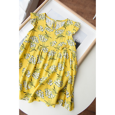 Krāsaina bērnu kleita ar lokām un apaļu kakla izgriezumu