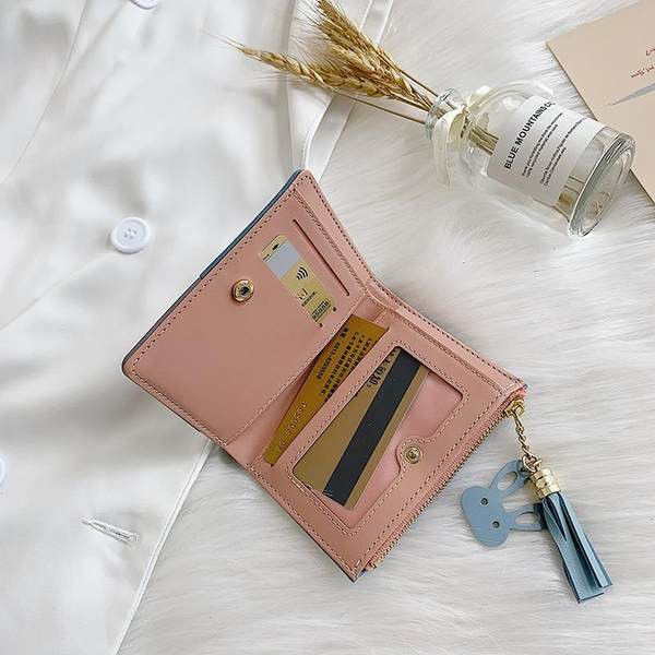 Γυναικείο πορτοφόλι με φερμουάρ και φούντα 