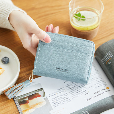 Γυναικείο δερμάτινο πορτοφόλι με φούντα