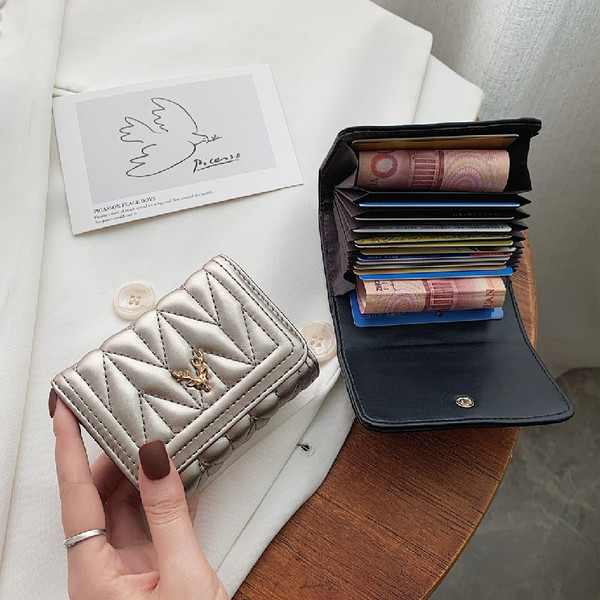 Γυναικείο έκο δερμάτινο πορτοφόλι με μεταλλική διακόσμηση σε τέσσερα χρώματα